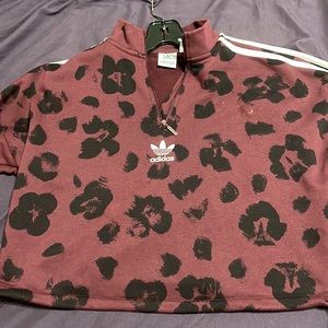 Collared adidas jacket in maroon w/ leopard print in medium.